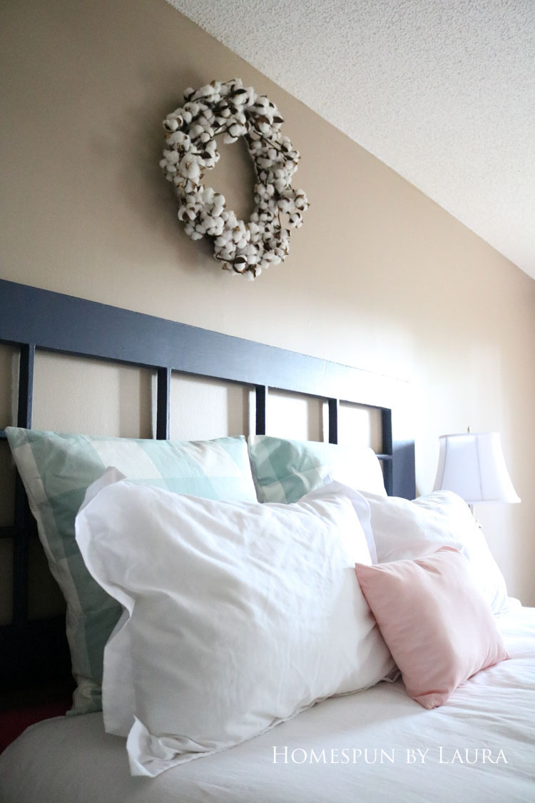 Master bedroom refresh | Homespun by Laura | Budget master bedroom farmhouse style redecoration with cotton wreath over bed