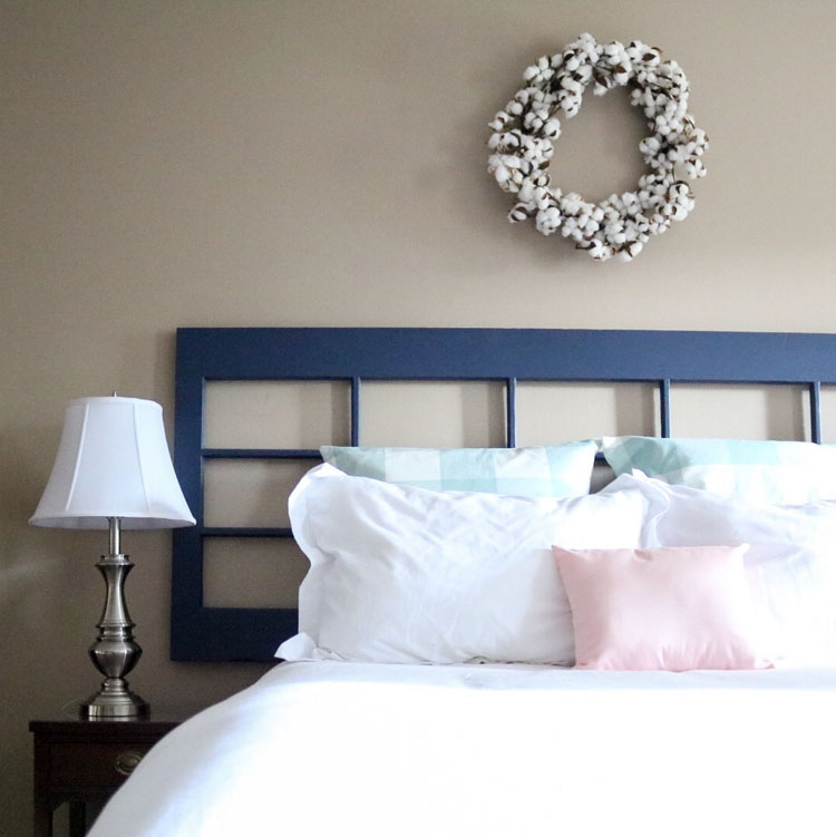 Master bedroom refresh: old French door headboard | Homespun by Laura | DIY pillow made from spare armrest covers