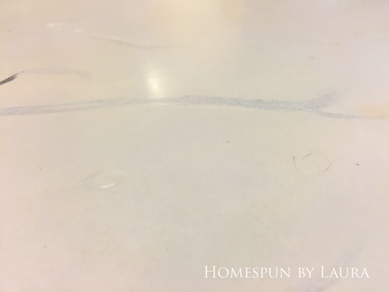 Stripping the faux painted marble finish down to original butcher block on my navy kitchen island | Homespun by Laura