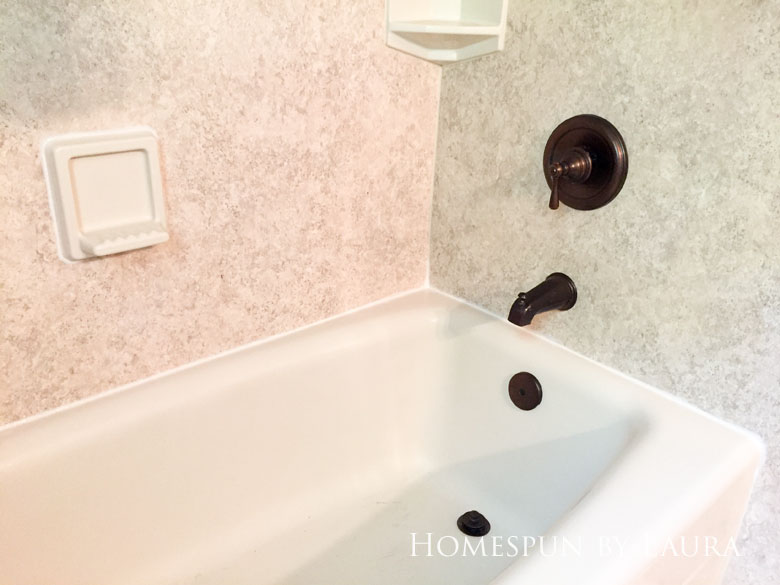 Replacing old caulk makes a dramatic impact in a bathroom. | Homespun by Laura