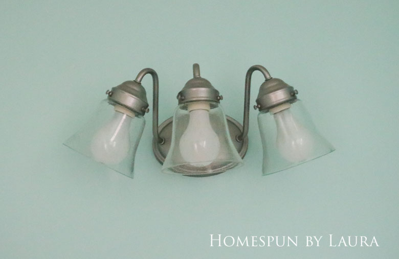 The $200 Master Bathroom Refresh | Homespun by Laura | Easy and inexpensive DIY updated light fixture with spray paint and new globe covers for under $20.