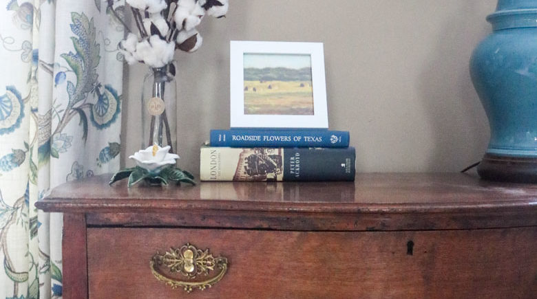 Cleaned up antique brass hardware, cotton stems, and hardback books dress up a boring desk in the den | Homespun by Laura
