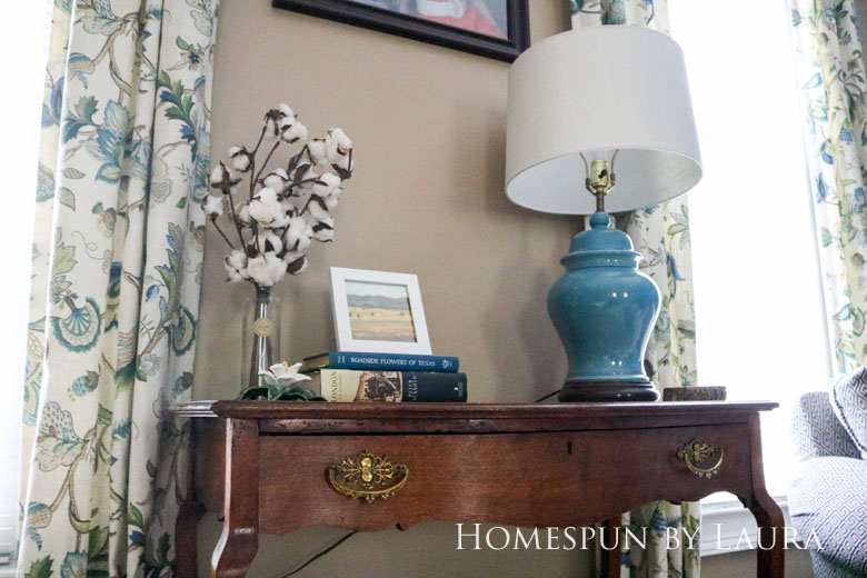 Cleaned up antique brass hardware, cotton stems, and hardback books dress up a boring desk in the den | Homespun by Laura