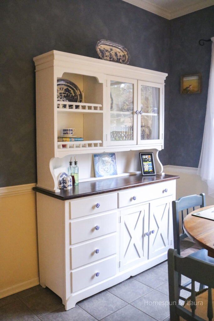 DIY white painted hutch with blue and white dishes